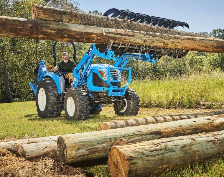 Maintaining Lawn Perfection with Gas Mower Gentleman mowing large garden area with a high-capacity gas mower.